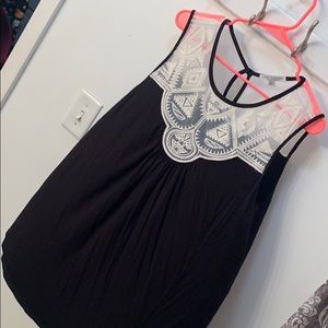 Flowy black top with design